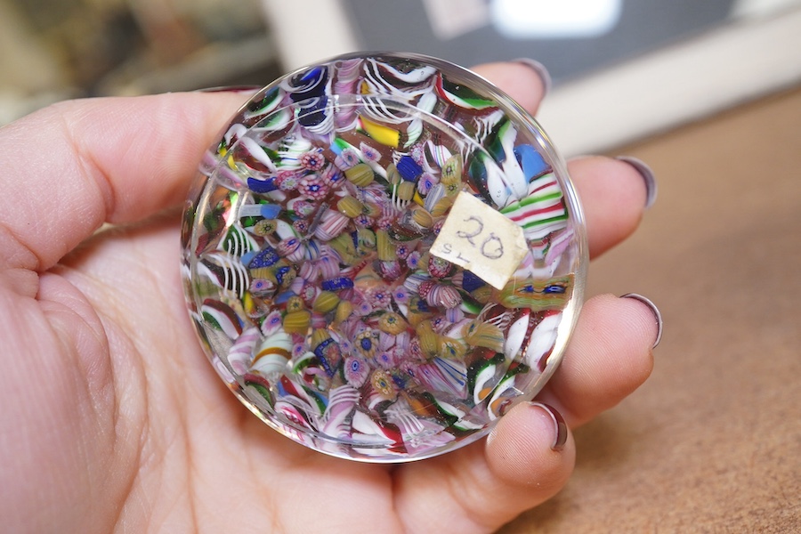 A scrambled millefiori paperweight, with cane bearing date 1847, 6cm in diameter. Condition - good, minor scuffs